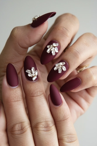 Deep Burgundy Matte Almond Nails with Crystal Embellishments