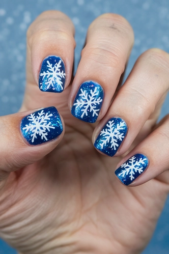 Glitter-Dusted Blue Snowflake Nails